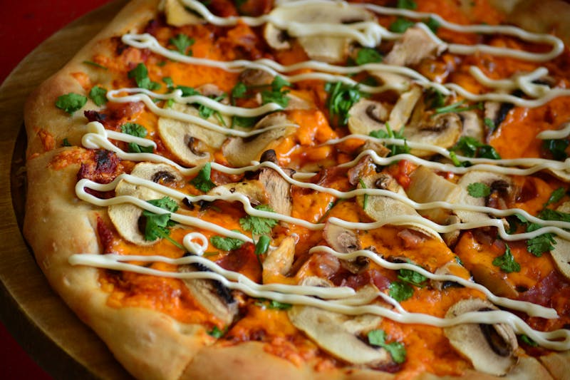 Truffle Mushroom specialty ranch pizza with wild mushrooms and truffle oil