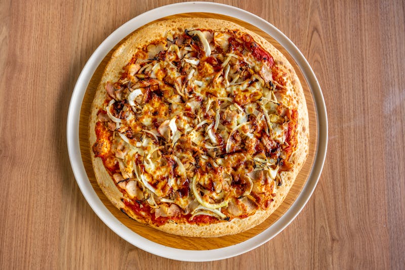 BBQ Chicken ranch pizza with smoked BBQ sauce and grilled chicken